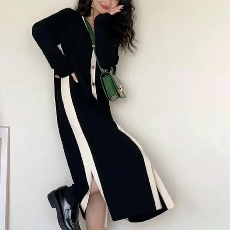 Women’s black long sleeve A-line knitted midi dress by Plush Fashion Hub, featuring a fitted waist and soft knit fabric.