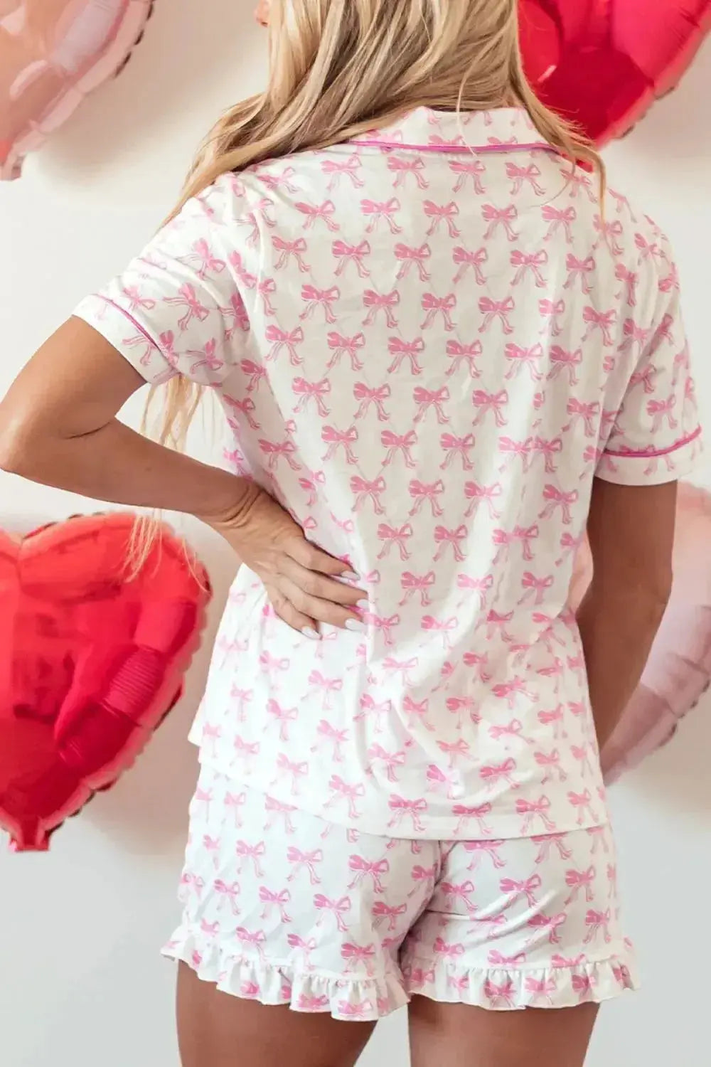Women's bow detail pajama lounge set with soft polyester shorts and matching shirt, comfortable sleepwear by Trendsi.