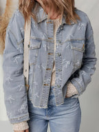 Women’s light wash denim jacket with bow knot print, raw hem, and classic denim style by Trendsi.