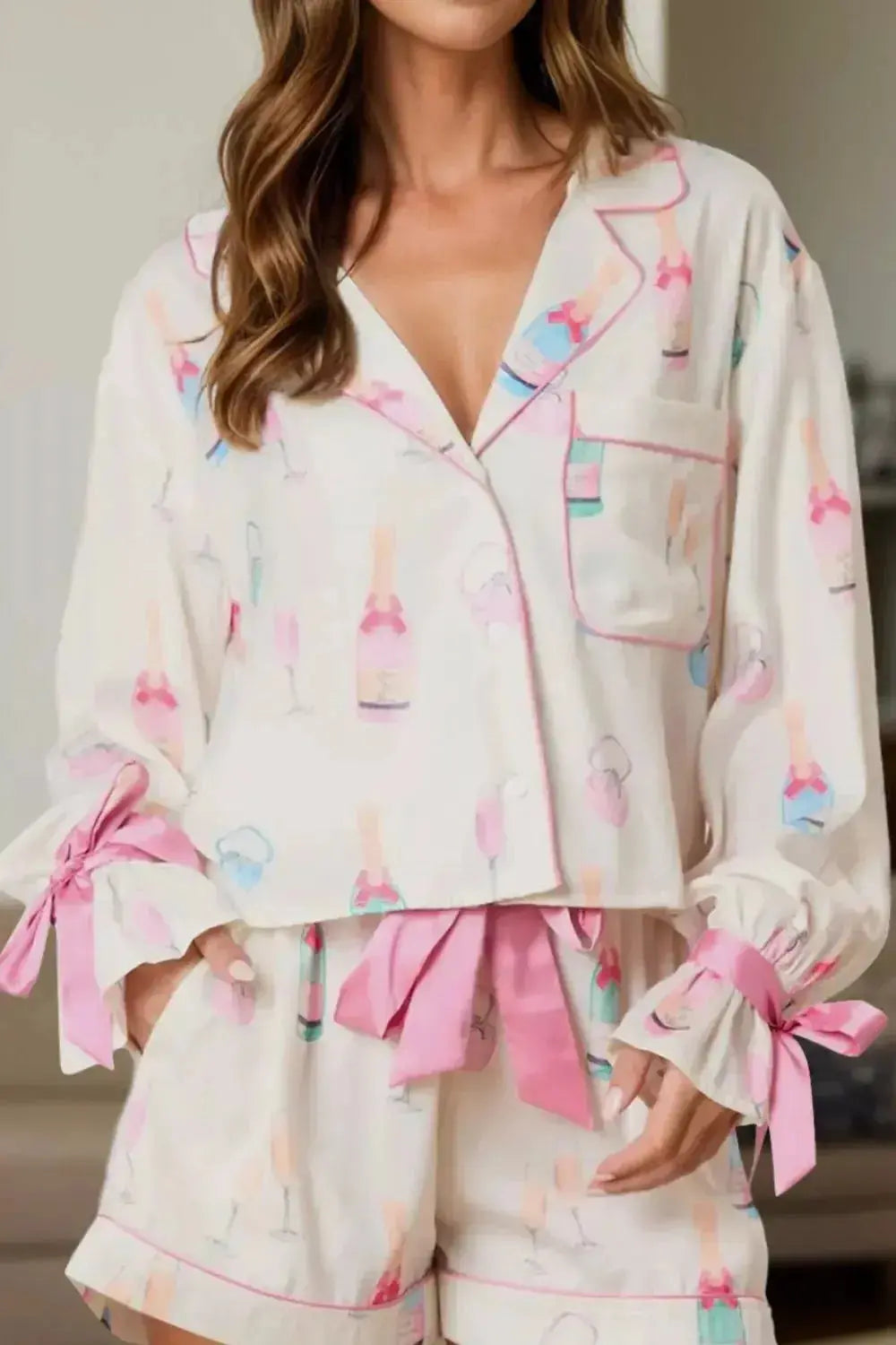 Women's bow print collared lounge top and drawstring shorts pajama set by Trendsi, featuring soft fabric and comfortable fit.