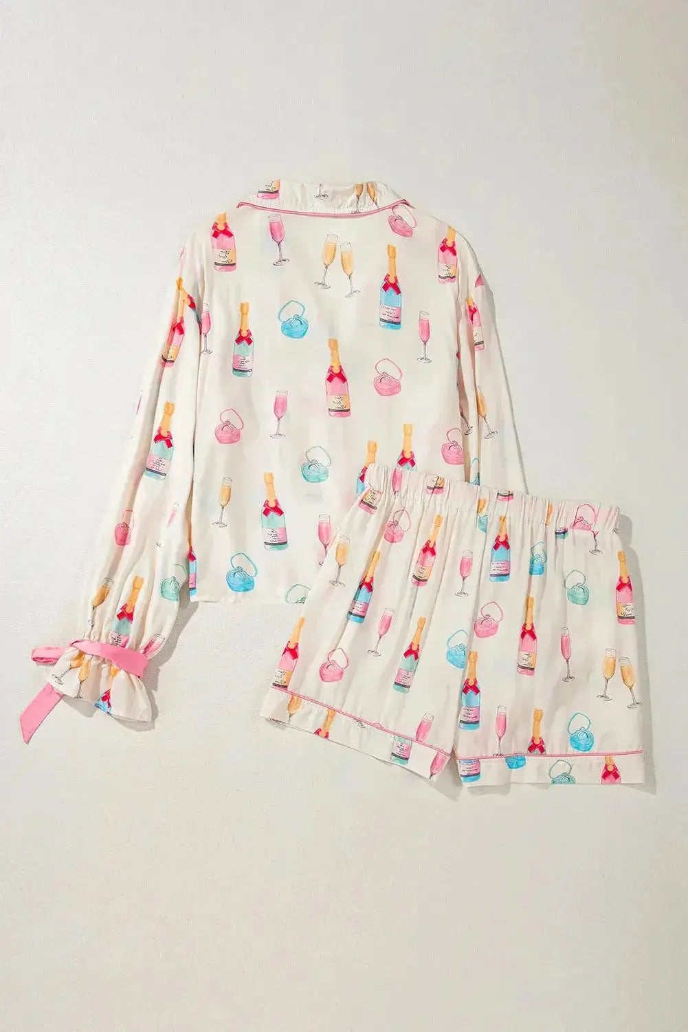 Women’s bow print collared lounge top and drawstring shorts pajama set by Trendsi, cozy sleepwear for women.