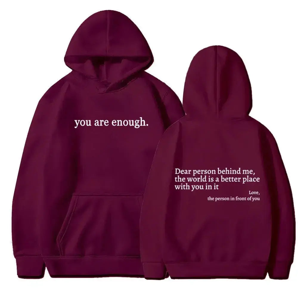 Women's brushed fleece hoodie with letter graphic from Plush Fashion Hub, soft oversized pullover in cozy fabric.