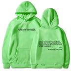 Women’s brushed fleece hoodie with letter graphic, soft oversized pullover by Plush Fashion Hub, front view showing cozy design.