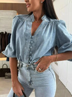 Women's button-down puff sleeve denim blouse by Trendsi, featuring structured casual chic design and classic denim fabric.
