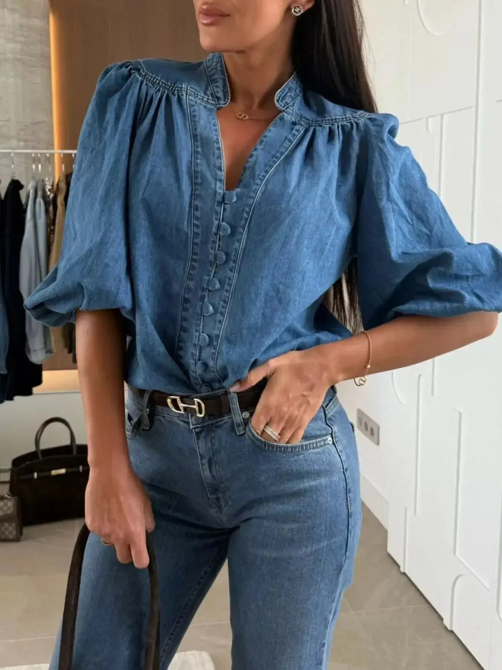 Women’s button-down puff sleeve denim blouse featuring structured design and casual chic style by Trendsi.