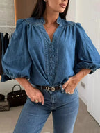 Women's button-down puff sleeve denim blouse by Trendsi, featuring structured casual chic design and classic denim fabric.