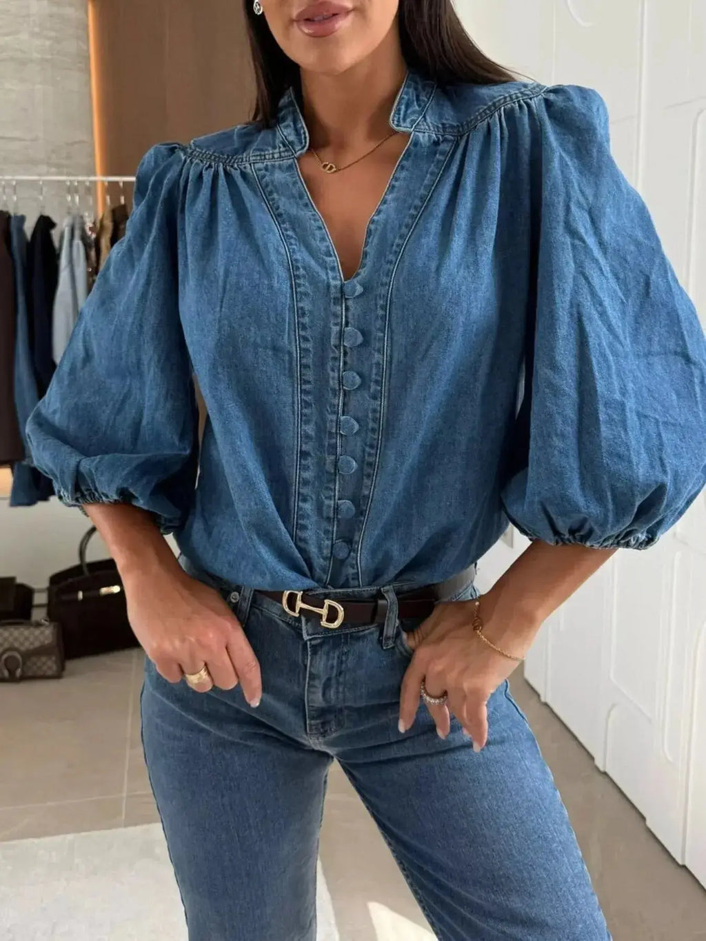 Women's button-down puff sleeve denim blouse by Trendsi, featuring a structured casual chic style, displayed on a model.