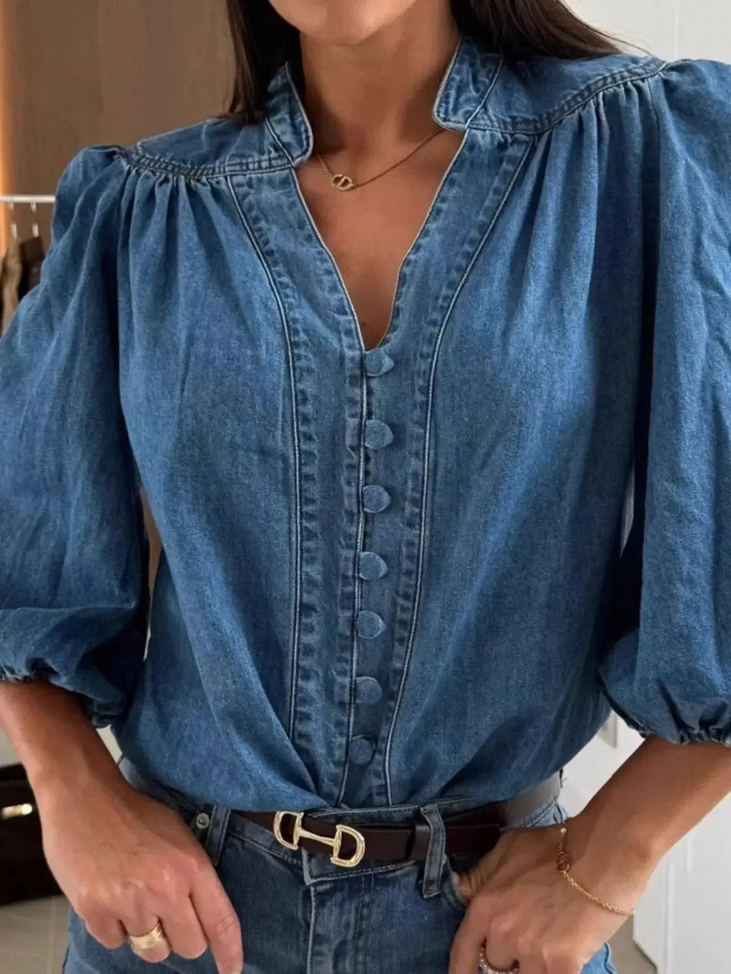 Women's button-down puff sleeve denim blouse by Trendsi, featuring a structured casual chic fit and classic denim fabric.