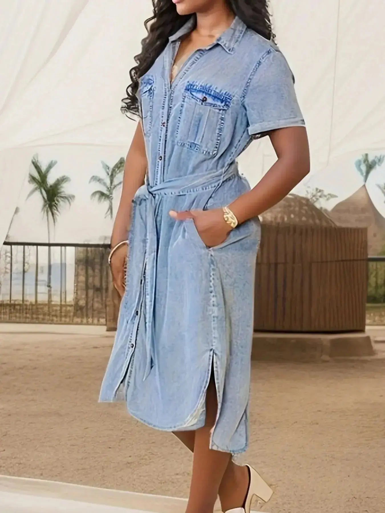 Women’s short sleeve belted denim dress by Trendsi, featuring a button-front design and cotton blend fabric.