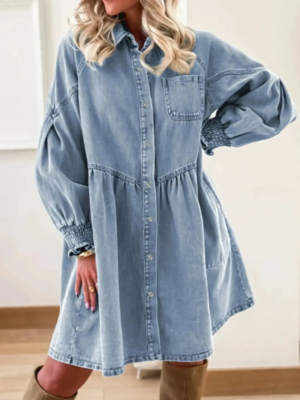 Women's casual denim shirt dress with button-up front and smocked cuffs, trendy Trendsi denim dress on a model.