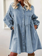 Women's casual denim shirt dress with button-up front and smocked cuffs, stylish Trendsi denim dress for everyday wear.