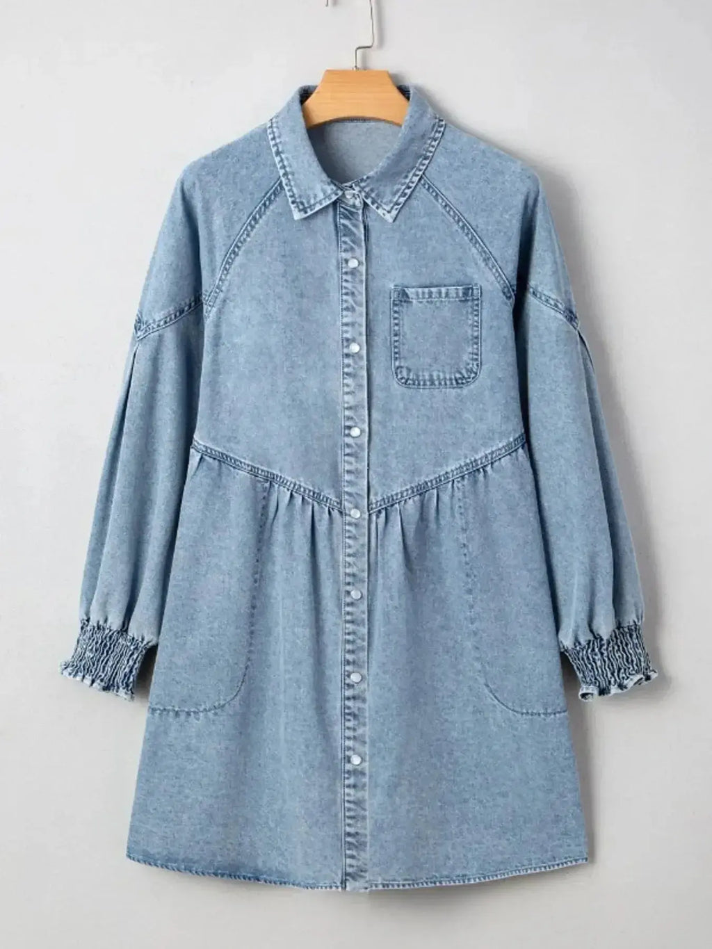 Women’s casual denim shirt dress with button-up front and smocked cuffs, stylish Trendsi denim dress for everyday wear.