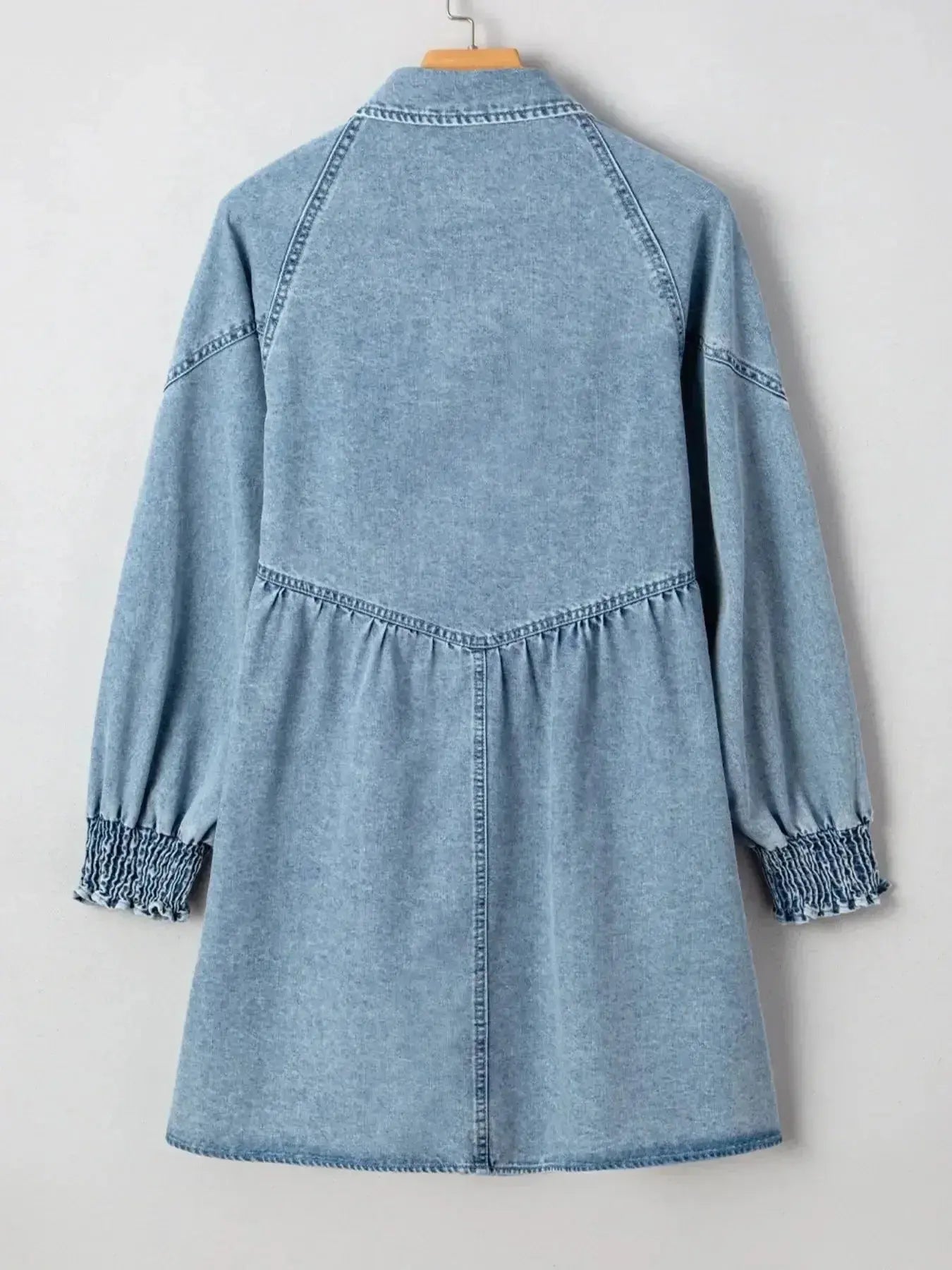 Women’s casual denim shirt dress with button-up front and smocked cuffs, trendy Trendsi denim dress for everyday wear.