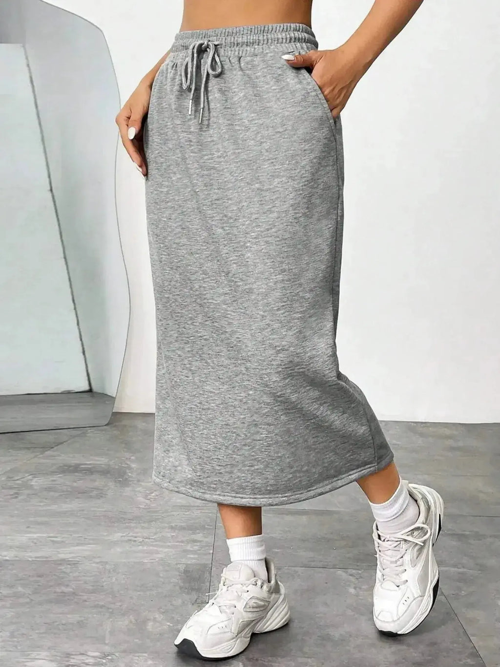Women's casual drawstring midi skirt with pockets and side slit, stylish and comfortable Trendsi skirt for everyday wear