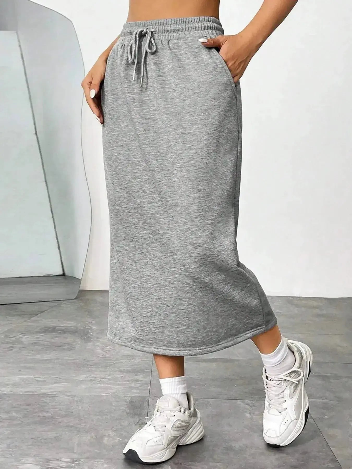 Women's casual drawstring midi skirt with pockets and side slit, stylish and comfortable Trendsi skirt for everyday wear