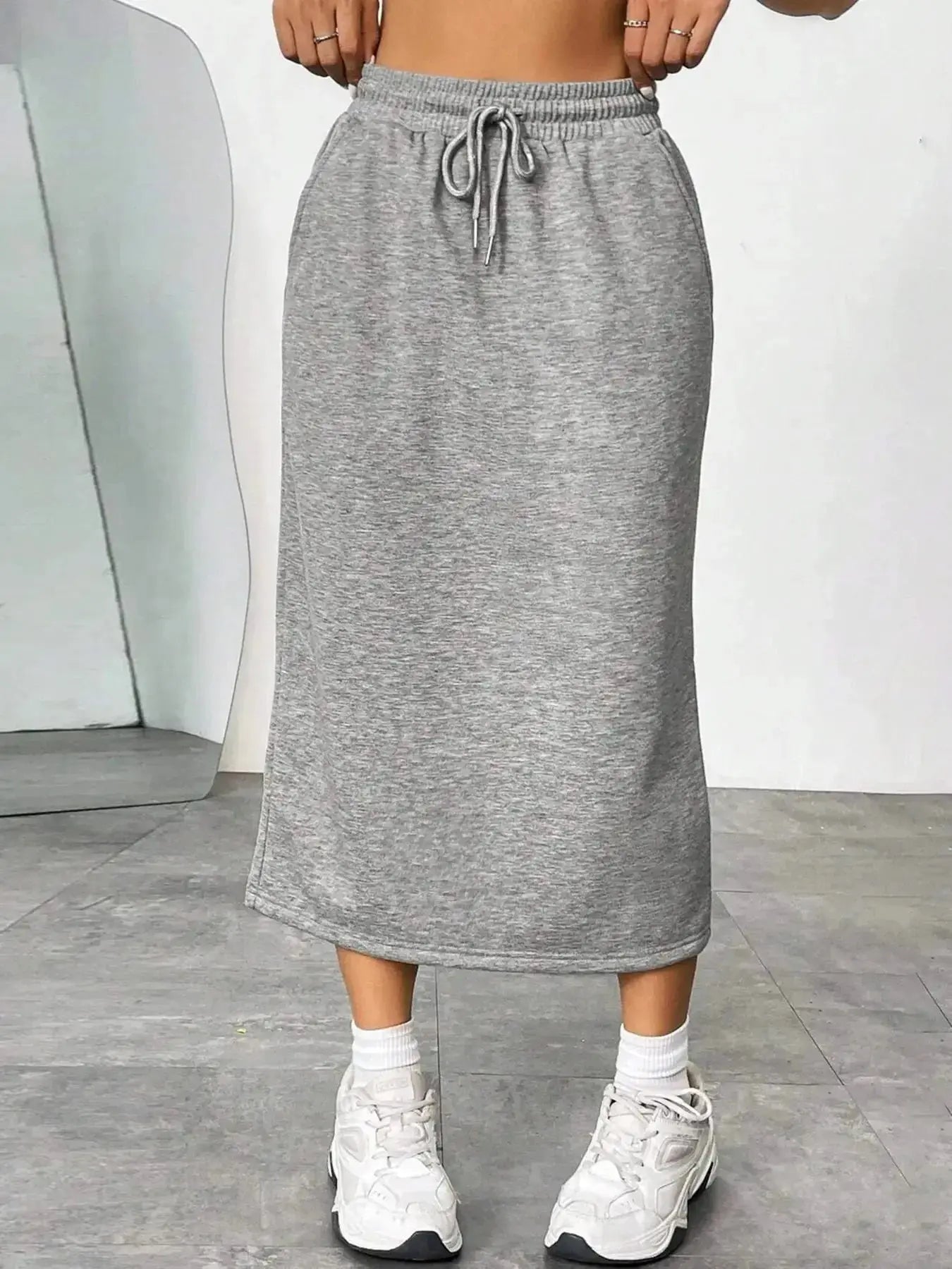 Women's casual drawstring midi skirt with pockets and side slit, trendy Trendsi skirt, comfortable and stylish for everyday wear.