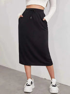 Women’s casual drawstring midi skirt with pockets and side slit, stylish and comfortable from Trendsi.