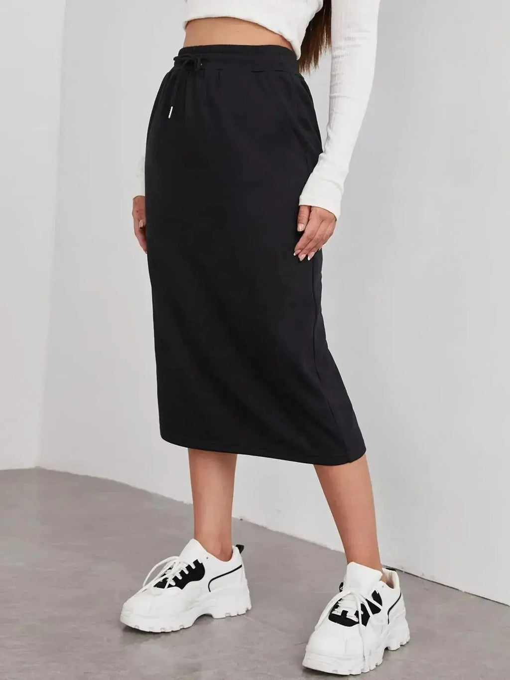 Women's casual drawstring midi skirt with pockets and side slit, trendy Trendsi skirt styled for everyday wear.