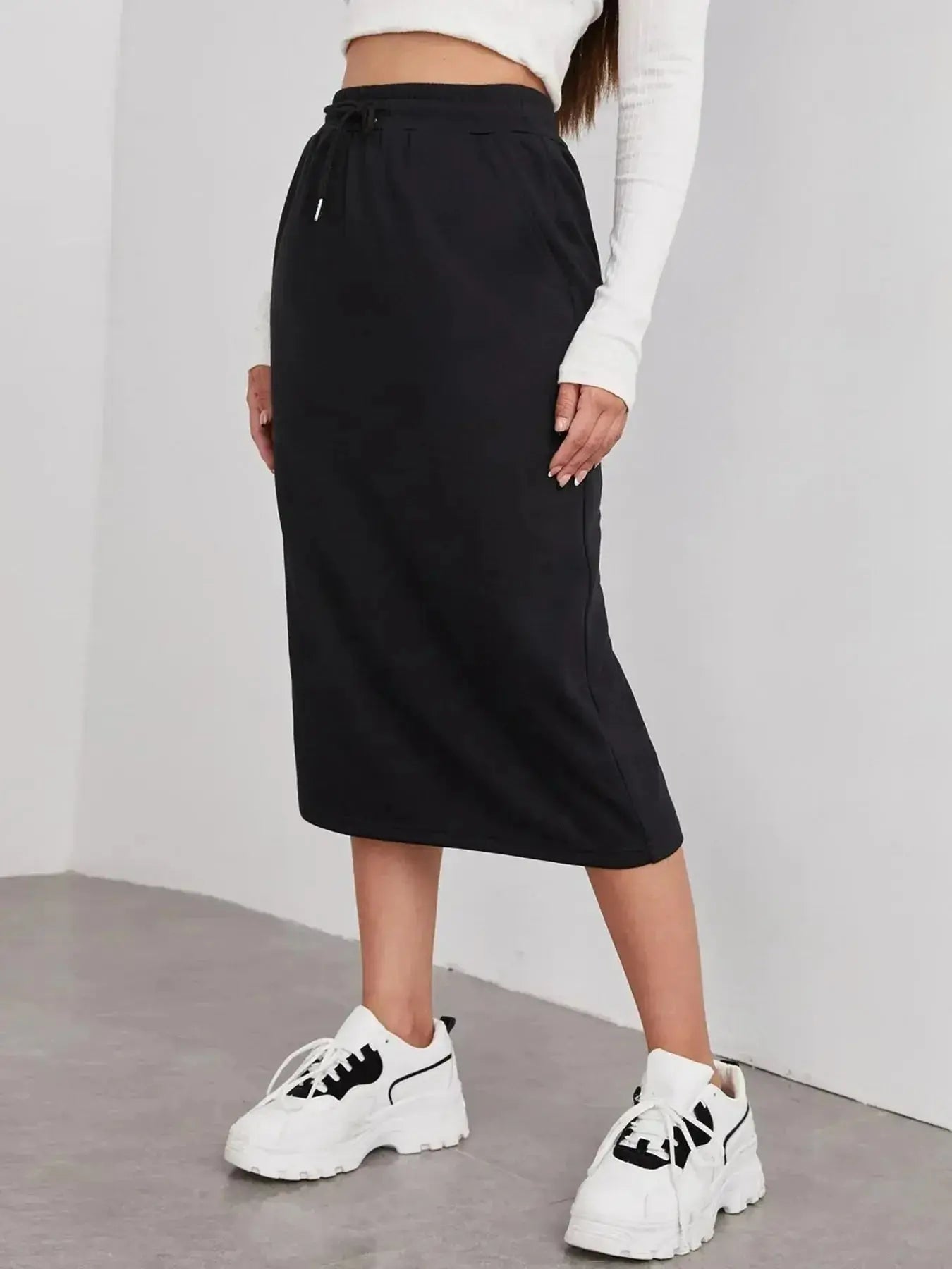 Women's casual drawstring midi skirt with pockets and side slit, trendy Trendsi skirt styled for everyday wear.