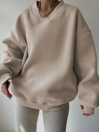 Women’s soft long sleeve crew neck sweater in a solid color, casual knit pullover by Plush Fashion Hub.