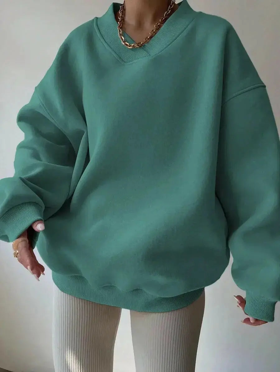 Women’s soft long sleeve crew neck sweater from Plush Fashion Hub, solid color casual knit pullover for relaxed style.