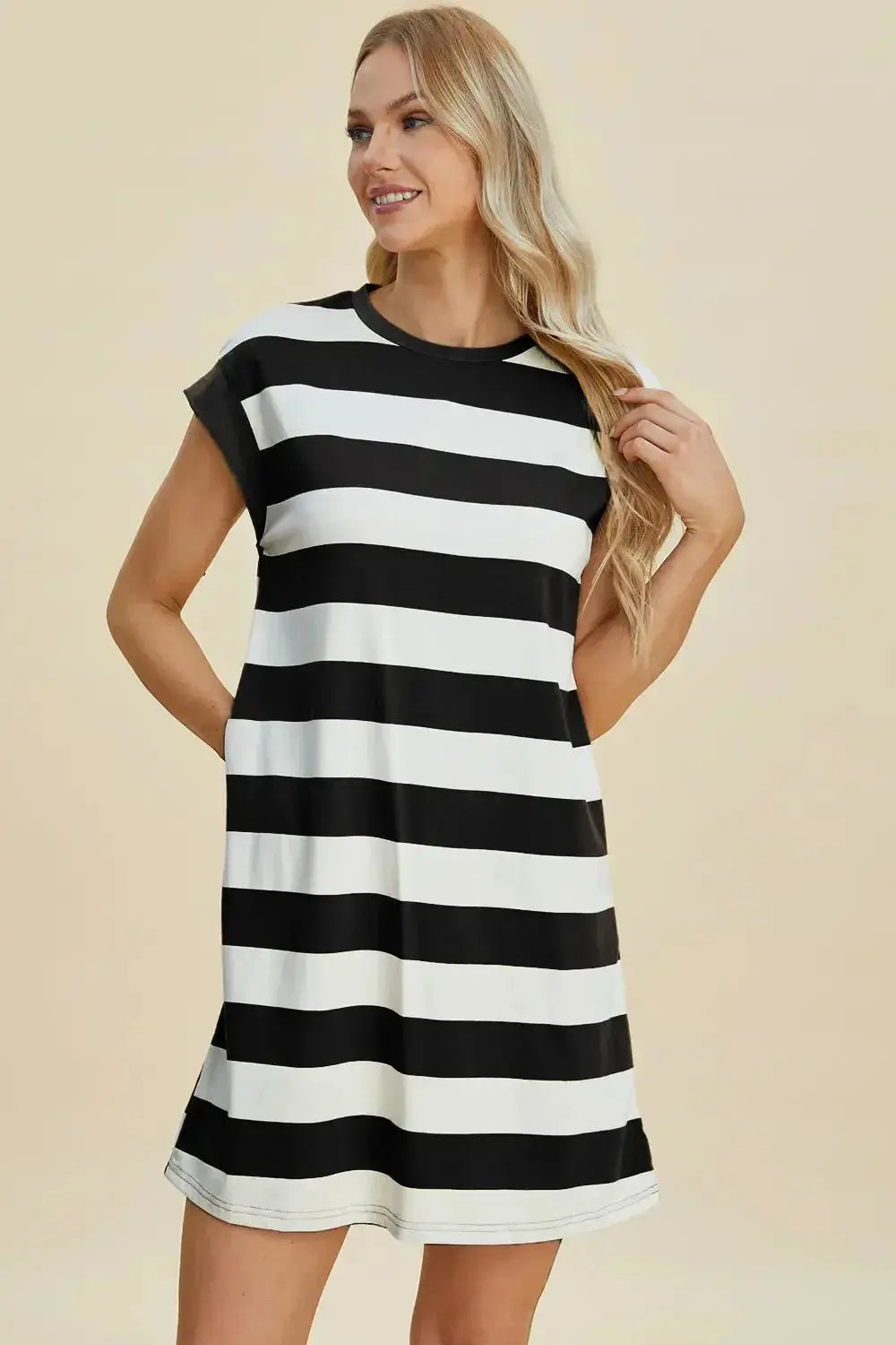 Women's casual striped mini dress by Trendsi with round neck and cap sleeves, perfect for a stylish and comfortable look.