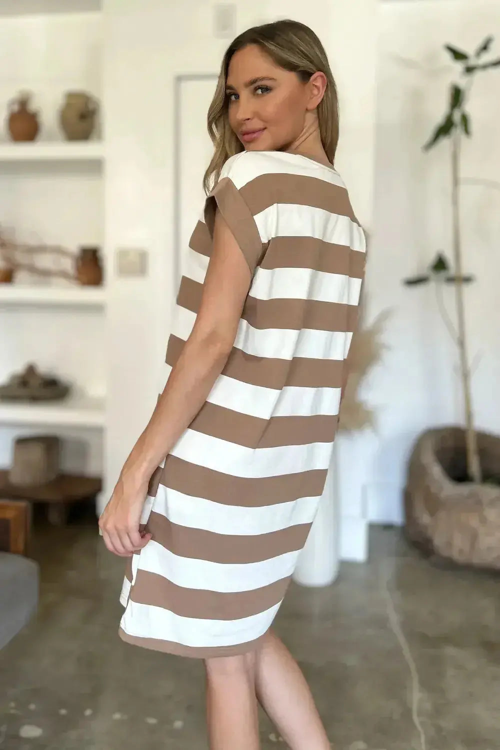 Women’s casual striped mini dress with round neck and cap sleeves, stylish and comfortable for everyday wear.