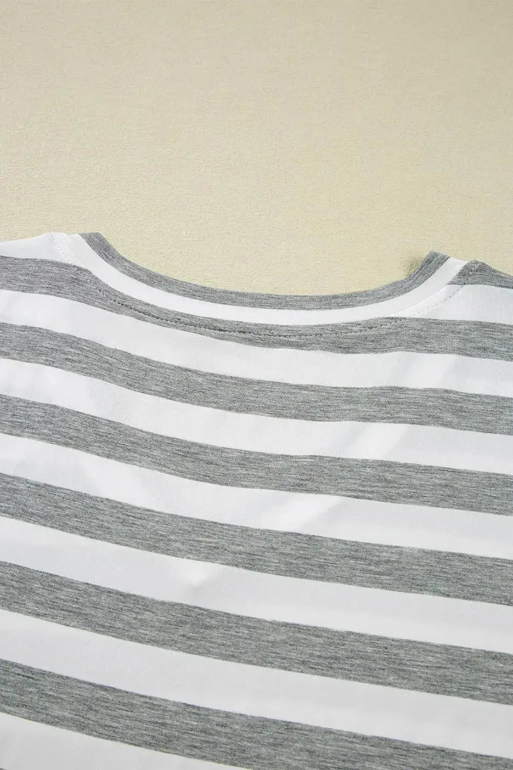 Women’s casual striped V-neck midi T-shirt dress by Plush Fashion Hub, featuring a comfortable fit and stylish design.