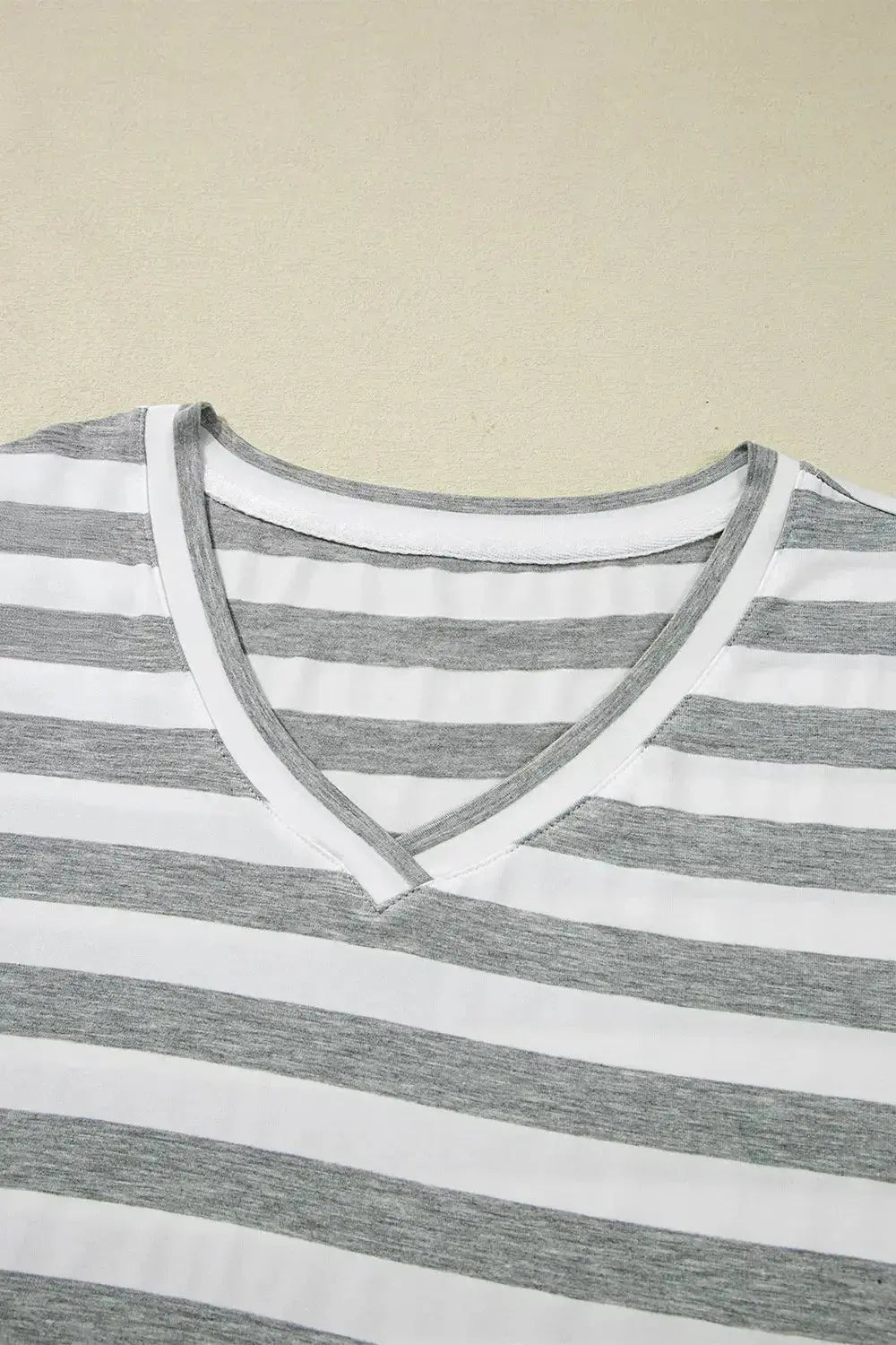 Women’s casual striped V-neck midi T-shirt dress by Plush Fashion Hub, featuring a relaxed fit and stylish design.