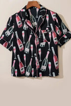 Women's champagne print short sleeve pajama top and shorts lounge set by Trendsi, comfortable sleepwear with elegant design.
