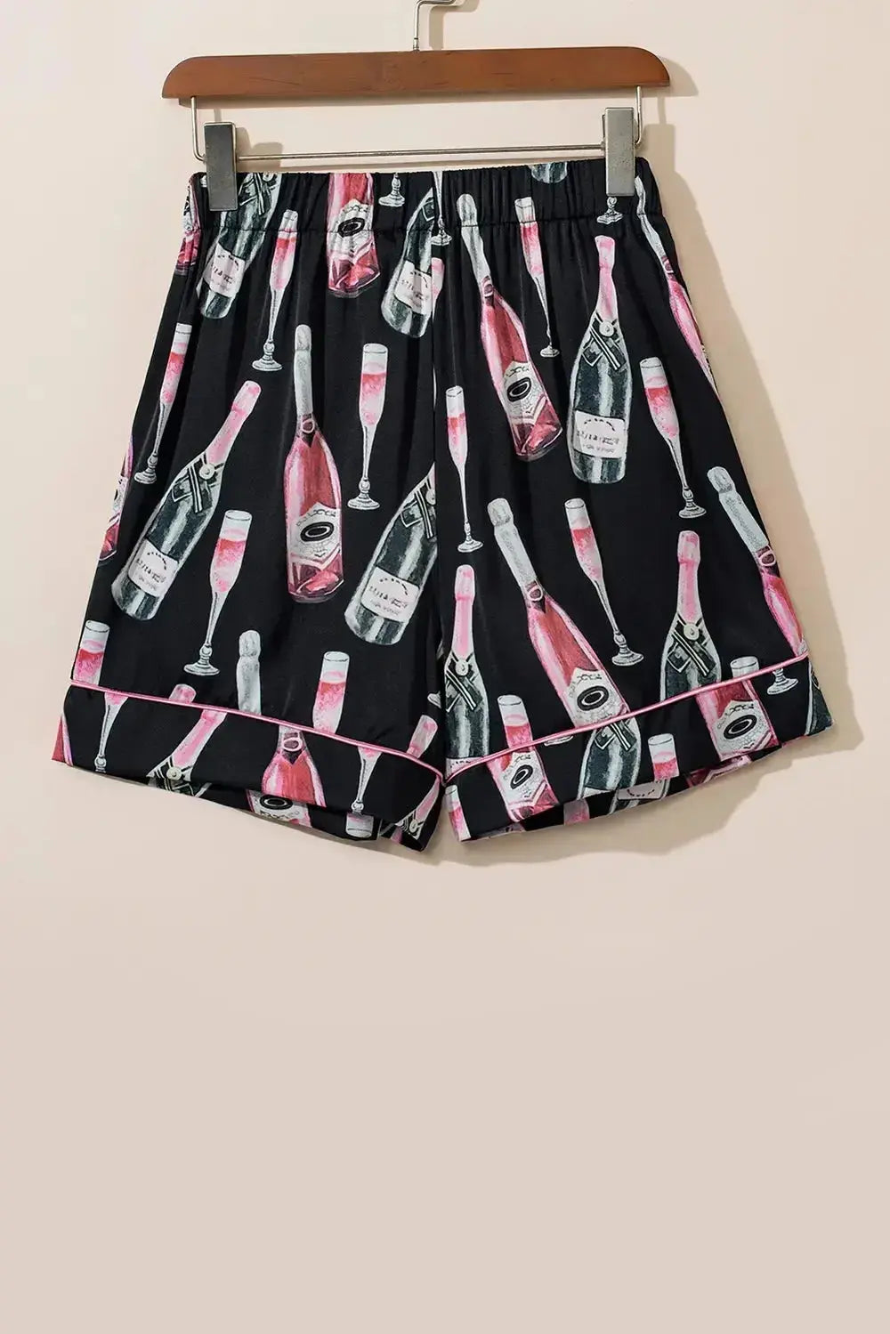 Women’s champagne print short sleeve pajama top and shorts lounge set by Trendsi, featuring a stylish and comfortable sleepwear ensemble.