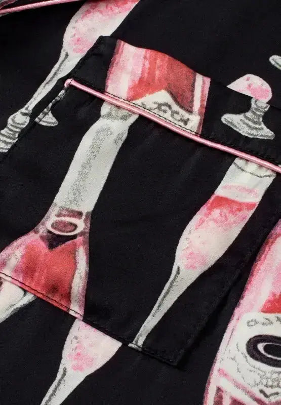 Women's champagne print short sleeve pajama top and shorts lounge set by Trendsi, soft fabric, relaxed fit, perfect for comfortable sleepwear.