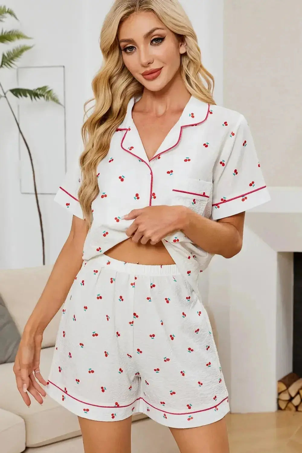 Women's cheery print collared pajama top and shorts lounge set by Trendsi, featuring button-down design and comfortable fit.