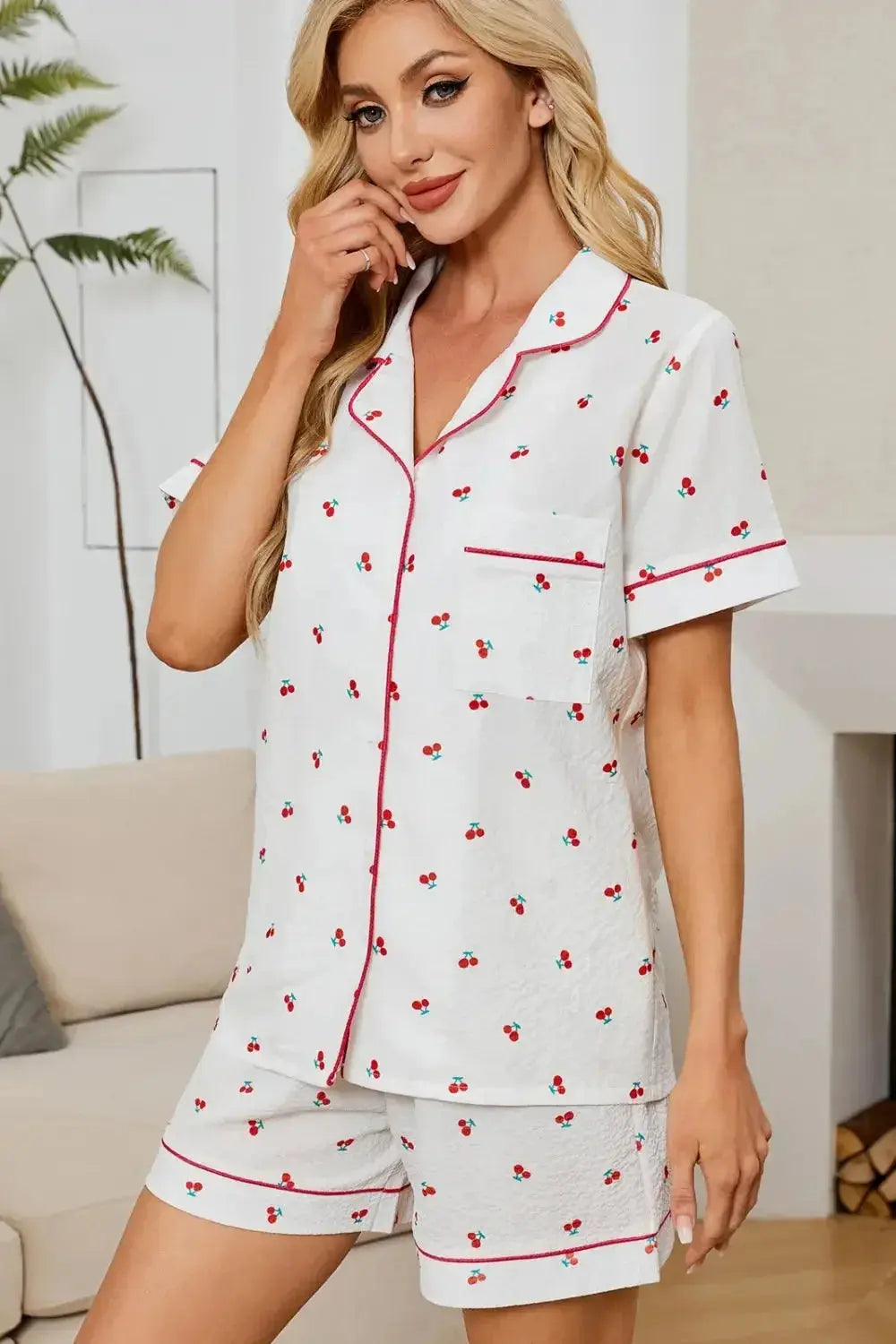 Women's cheery print pajama top and shorts lounge set with collar and button-down design by Trendsi.