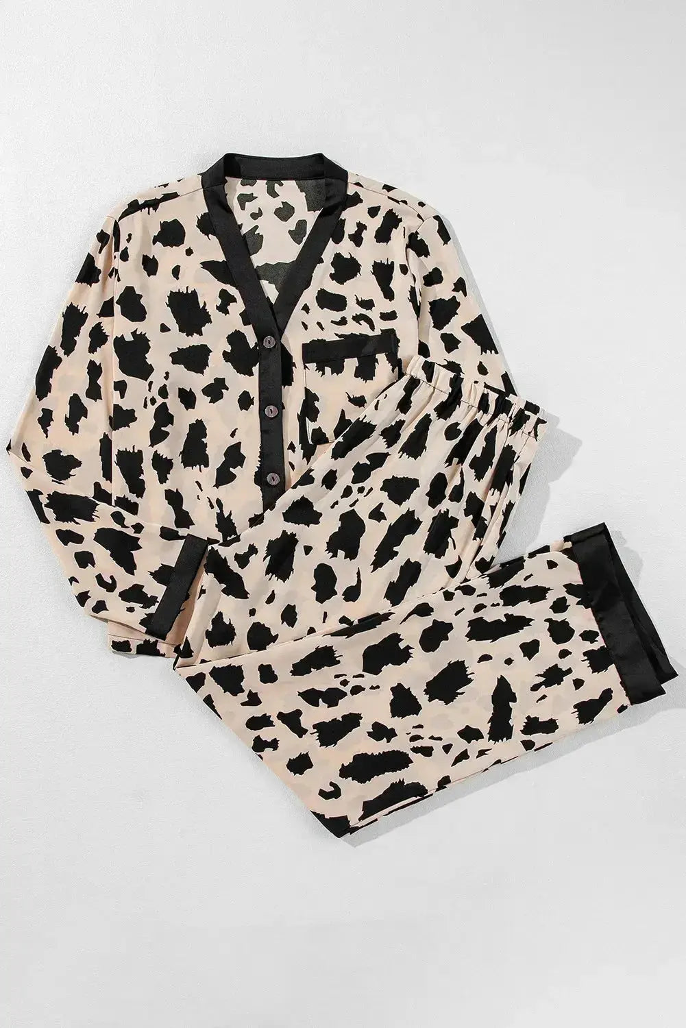 Women's classic button-down long sleeve pajama set by Trendsi, featuring soft lounge wear fabric and comfortable fit.