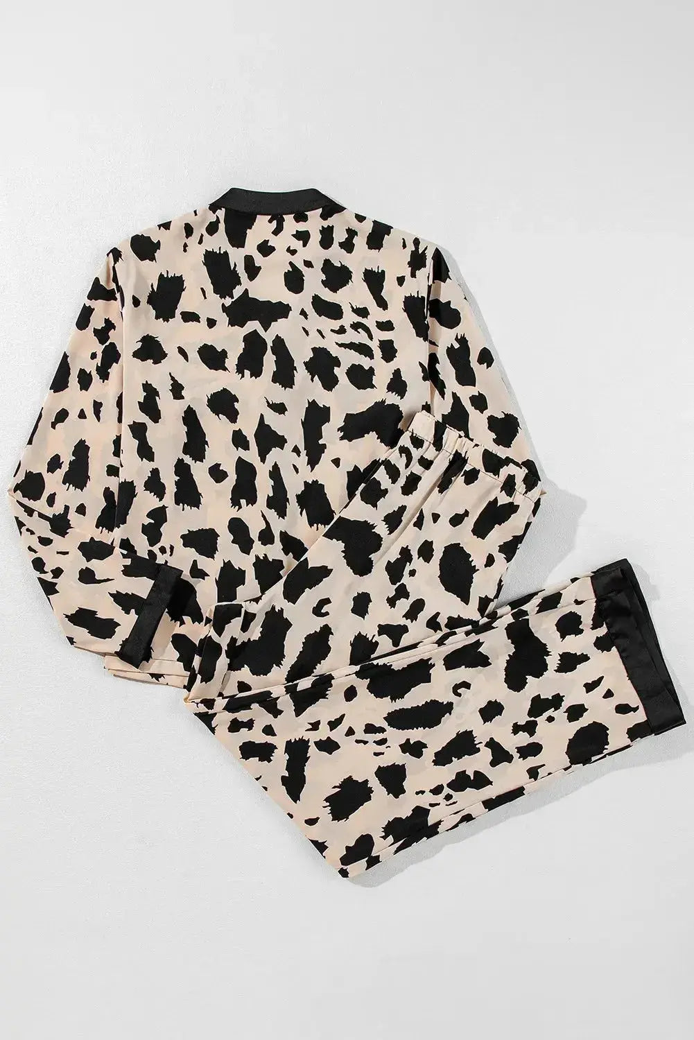 Women's classic button-down long sleeve pajama set by Trendsi, soft lounge wear with comfortable fit and cozy fabric.