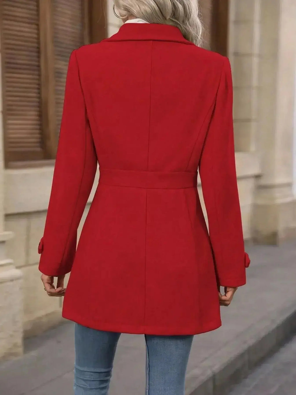 Women's classic button-front long sleeve layering coat, transitional outerwear by Trendsi, shown hanging on a wooden hanger.