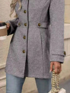 Women's classic button-front long sleeve layering coat, transitional outerwear by Trendsi, shown in neutral color.