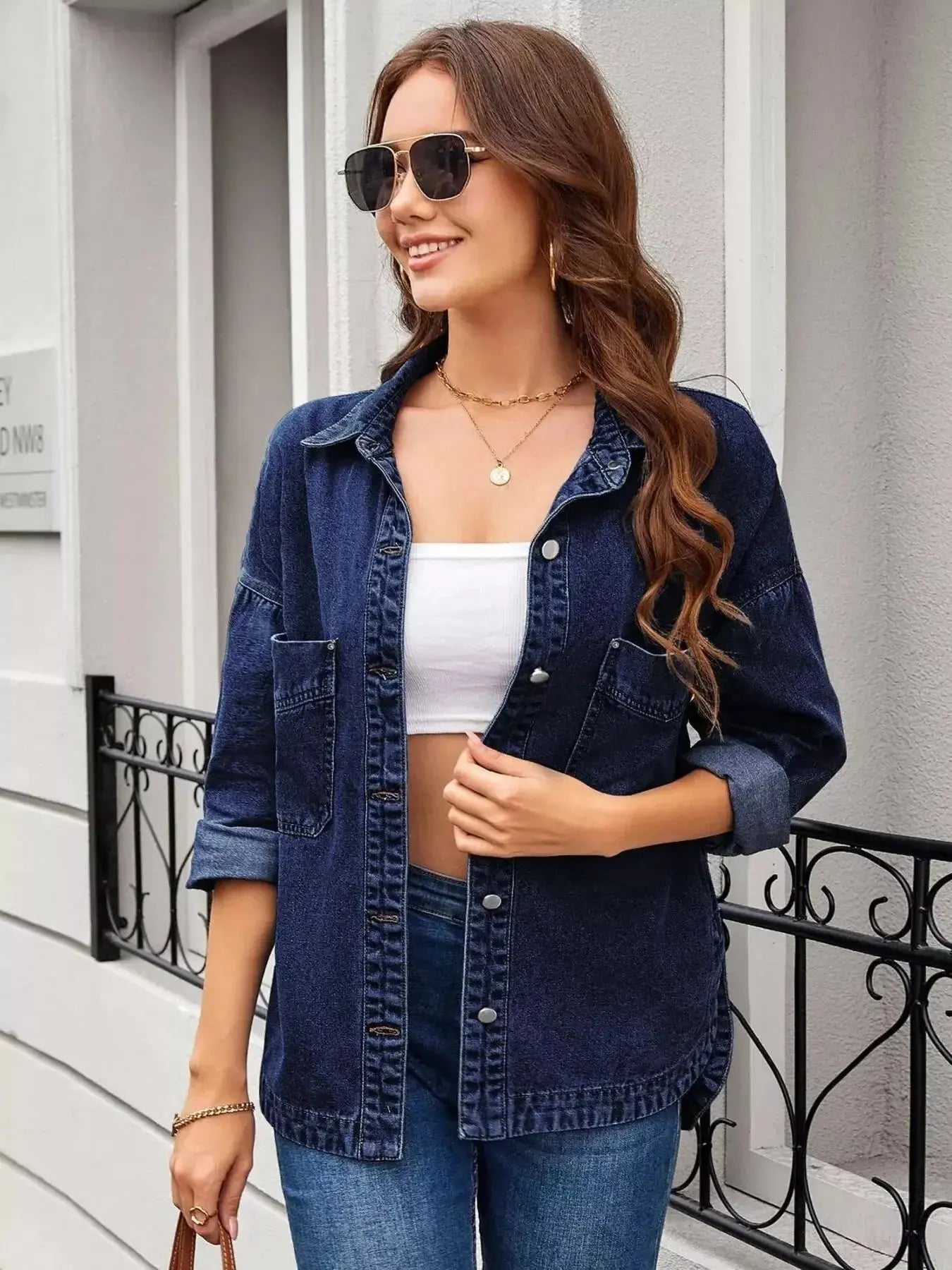 Women’s classic long sleeve denim shirt by Trendsi, featuring a button-up style made from premium cotton blend fabric.