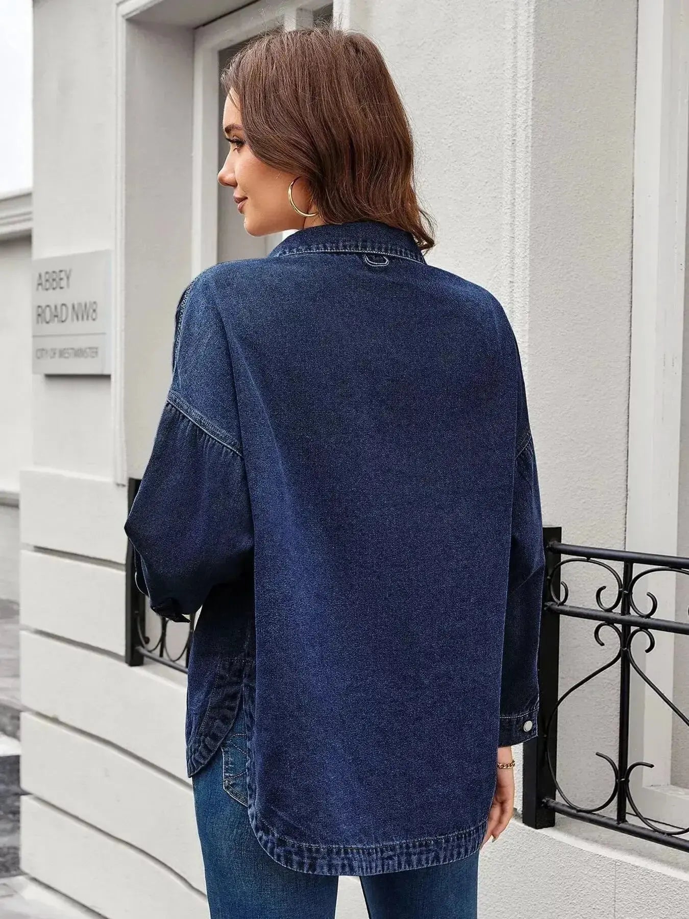 Women's classic long sleeve denim shirt by Trendsi, made from premium cotton blend, featuring button-up front and traditional denim style.