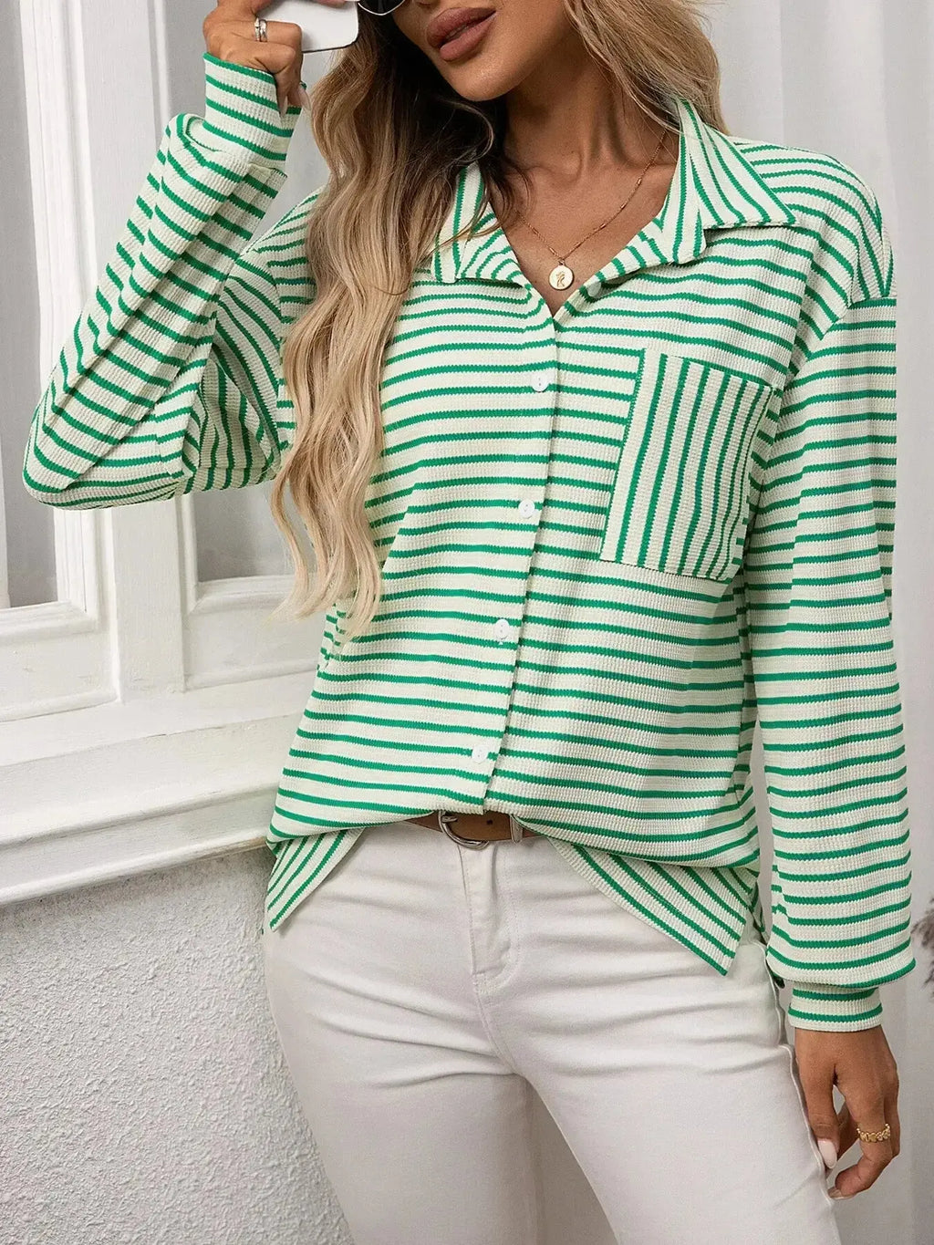 Women's classic striped long sleeve button-up shirt by Trendsi, perfect for versatile office wear, featuring a stylish, timeless design.