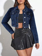 Women's cropped denim jacket by Trendsi, featuring classic cotton blend fabric and button-up front, styled for casual wear.