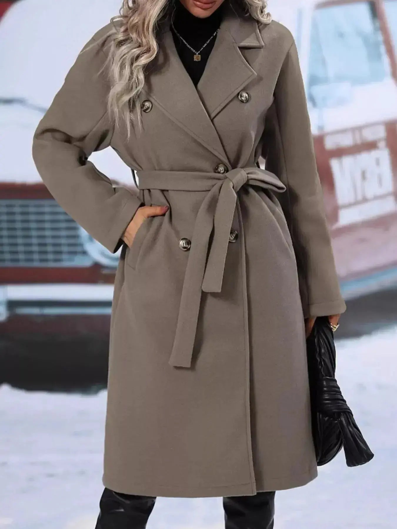Women's double-breasted trench coat with tie waist belt, stylish and tailored, perfect for a sophisticated look.