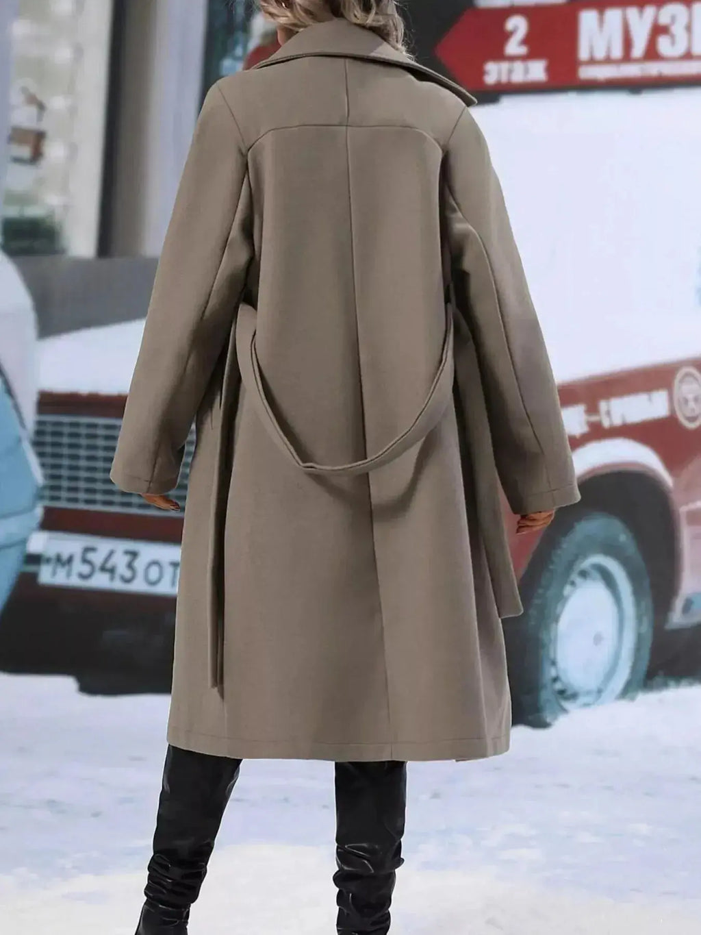 Women’s double-breasted trench coat with tie waist belt, stylish outerwear from Trendsi, featuring classic design and neutral color.