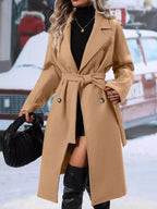 Women’s double-breasted trench coat with tie waist belt, stylish outerwear from Trendsi, shown on a model.