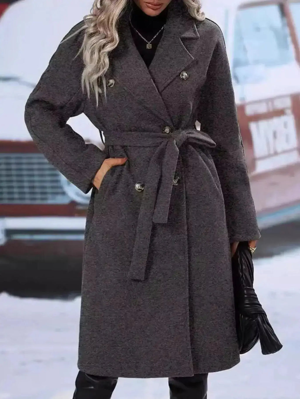 Women's double-breasted trench coat with tie waist belt, stylish and classic outerwear by Trendsi, shown on a model.