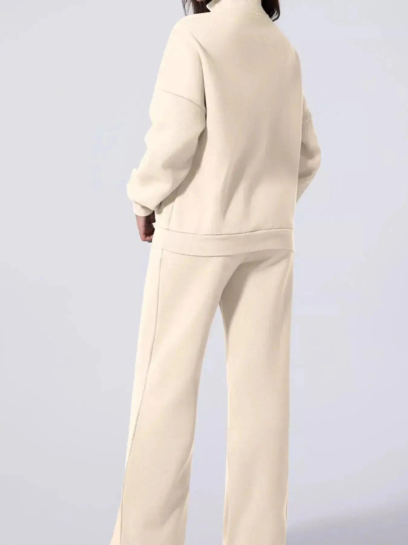 Women’s drop shoulder zip-up jacket and jogger lounge set by Trendsi, casual two-piece sweat suit with relaxed fit.