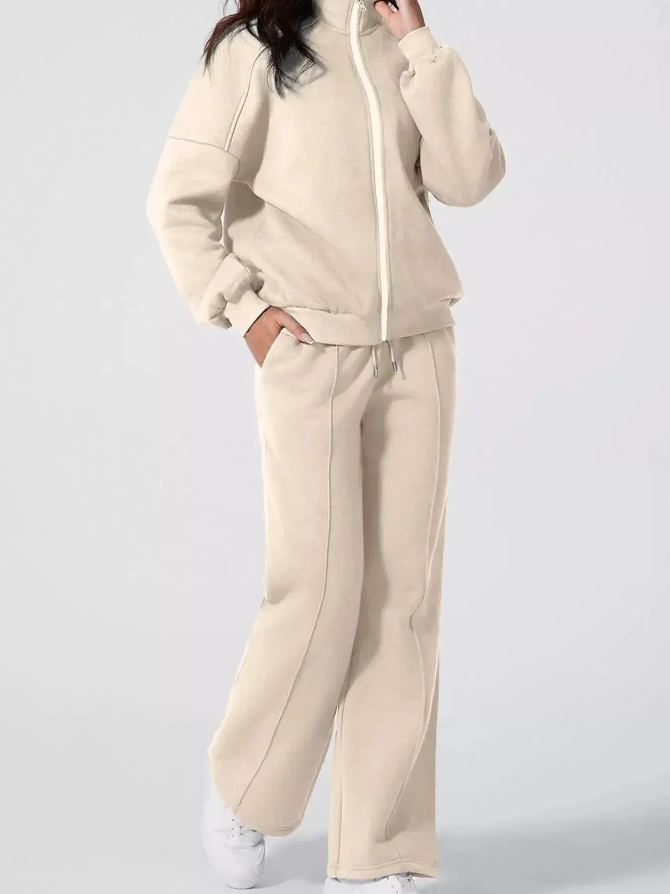 Women's drop shoulder zip-up jacket and jogger sweat suit from Trendsi, two-piece lounge set, comfortable casual wear.