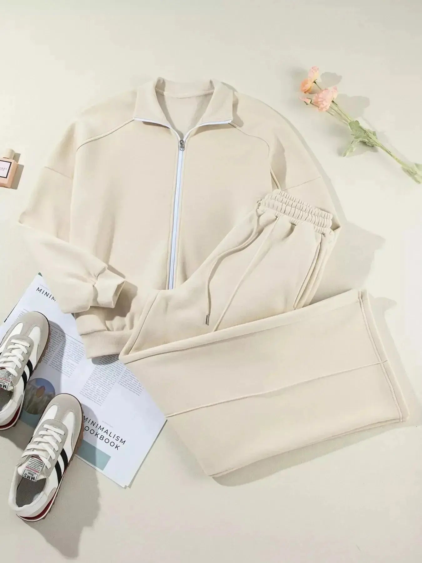 Women's drop shoulder zip-up jacket and jogger lounge set, trendy sweat suit from Trendsi, casual and comfortable activewear ensemble.