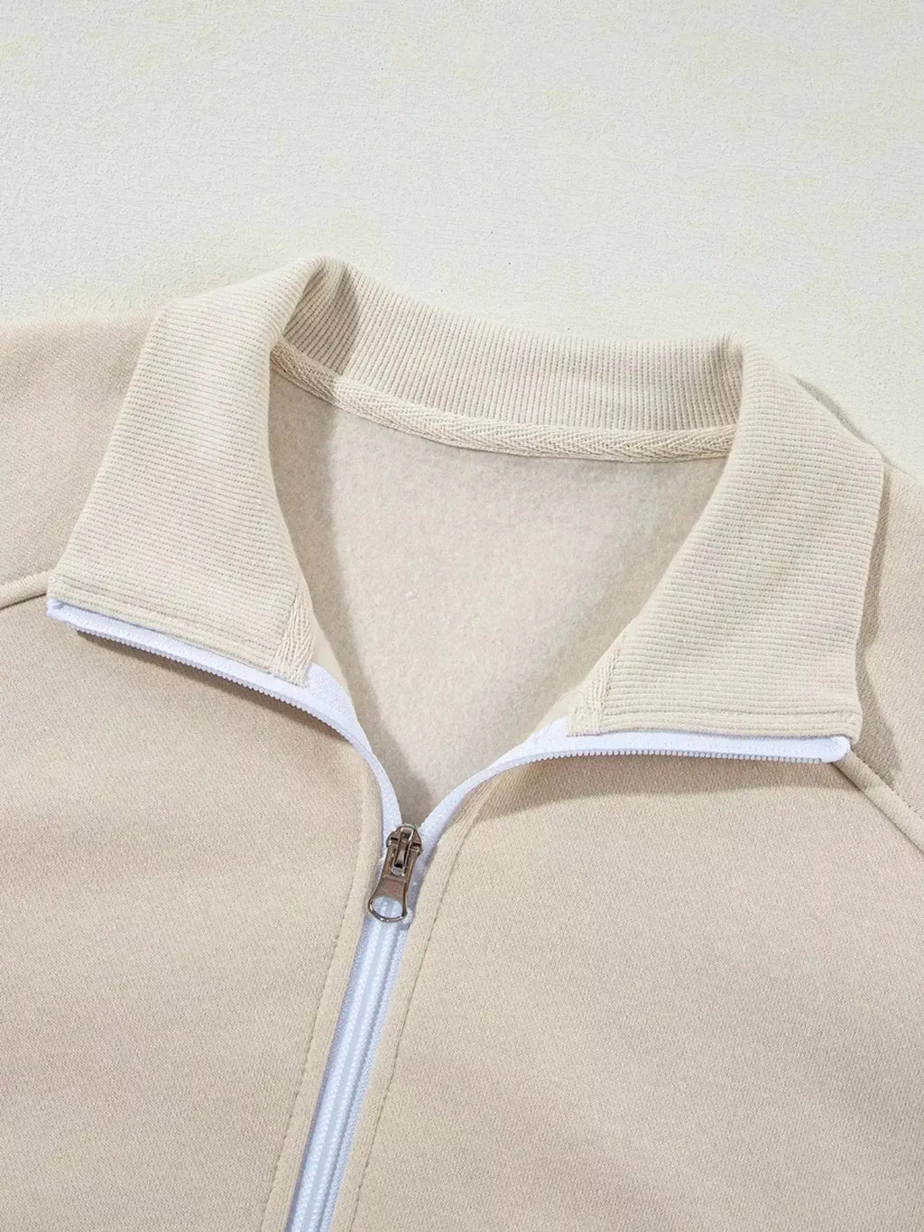 Women's drop shoulder zip-up hoodie and jogger lounge set by Trendsi, featuring a cozy sweat suit with relaxed fit and casual style.